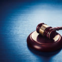 judge gavel on a blue wooden background