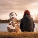 Woman and her dog on the lake