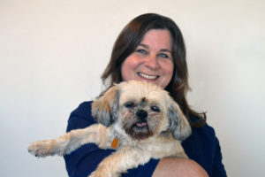 Sharon Miko holding a small dog