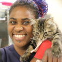 Animal care attendant with a cat