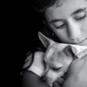Sad lonely girl hugging her small dog